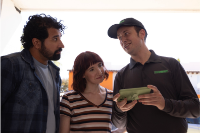 Couple interacting with technician